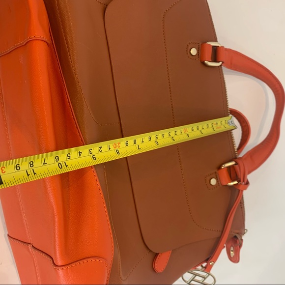 Orange handbag with a rust color body of bag and orange accent shoulder strap - Picture 15 of 16